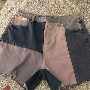 dark purple and light purple jean shorts with button up as zipper